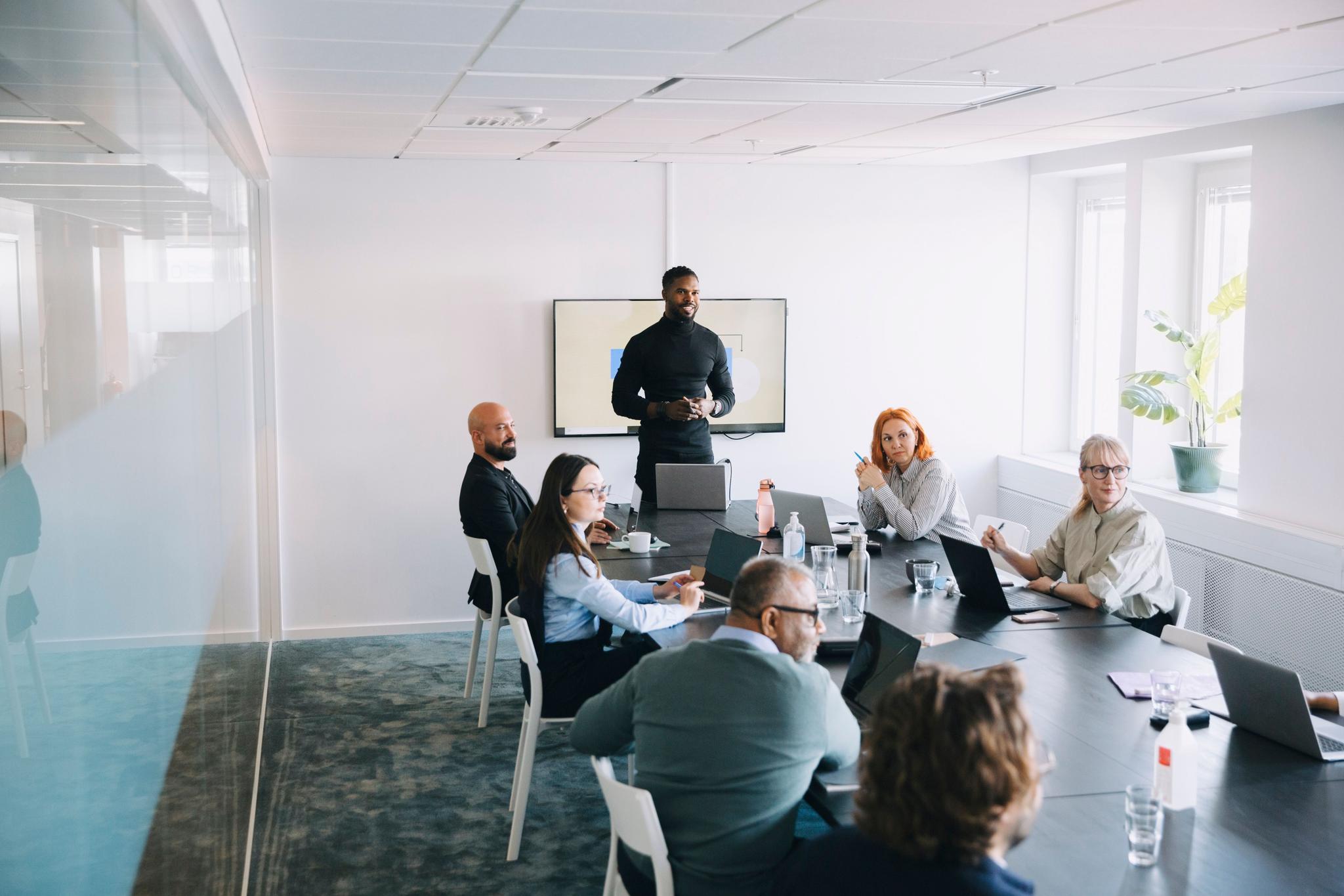 CMMC boardroom meeting with 6 professionals