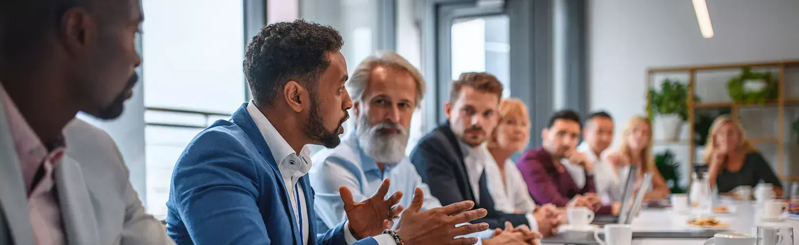 Board discussing the benefits of Diligent Board and Leadership Collaboration.